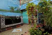 Harga Bagus! Rumah dengan Taman Indoor + Kolam Ikan di Graha Raya