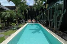 Charming 3-Bedroom Family Villa for Long-Term Rent, featuring a private pool, studio, and modern tropical design, fully furnished and centrally located in Canggu, minutes from Batu Bolong & Echo Beach | IP 675