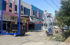 Three-story shop house on the main road.
