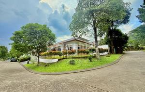 Minimalist House with Side Hook, Playground and Basketball Court in Front Cluster of Sentul City Bogor