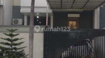 tampak depan rumah pantai mentari cluster caribean
