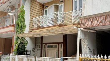 tampak depan rumah murah 2 lantai dalam