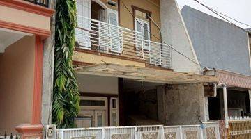tampak depan rumah murah 2 lantai dalam