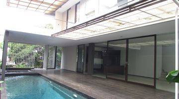 Gambar 2 A 2 storey, 4 bedroom, stand alone house located in Pondok Indah, Jakarta with 4 bathrooms, a pool and a yard.