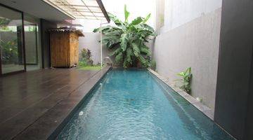 Gambar 1 A 2 storey, 4 bedroom, stand alone house located in Pondok Indah, Jakarta with 4 bathrooms, a pool and a yard.