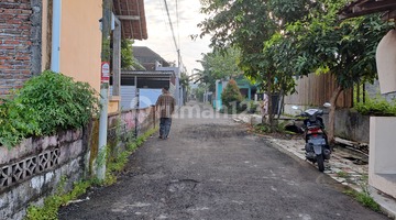tampak depan tanah strategis tepi aspal di