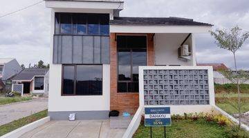 tampak depan rumah cluster tanah luas konsep