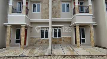tampak depan rumah cluster 2 lantai siap