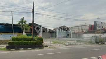tampak depan tanah dijual tepi jalan raya