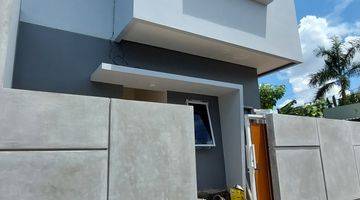 tampak depan rumah hoek 2 lantai di
