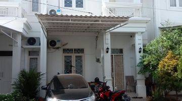 tampak depan rumah pondok bambu dalam cluster