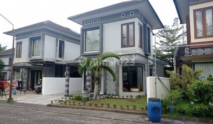 RUMAH DALAM PERUMAHAN ONEGATE SYSTEM DI PALAGAN  1