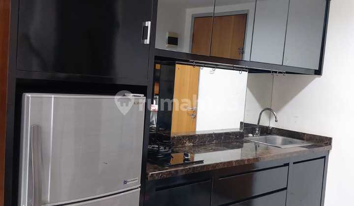 ruang tamu apartmen puncak permai 2 br