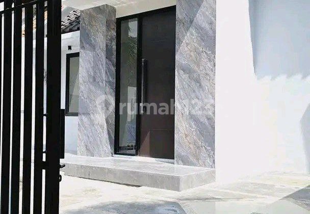 Rumah Taman Puspa Raya Citraland Surabaya