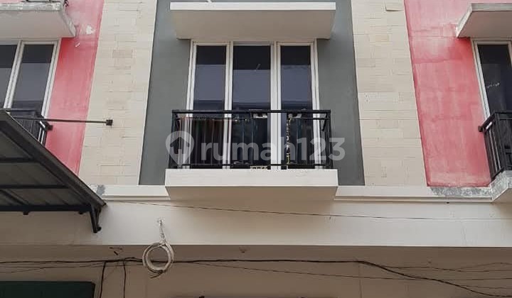 Ruko Siap Pakai Kondisi Bagus di Puri Gardena, 0055 Joc