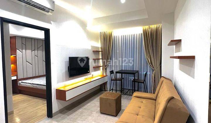 ruang keluarga apartemen the branz bsd city