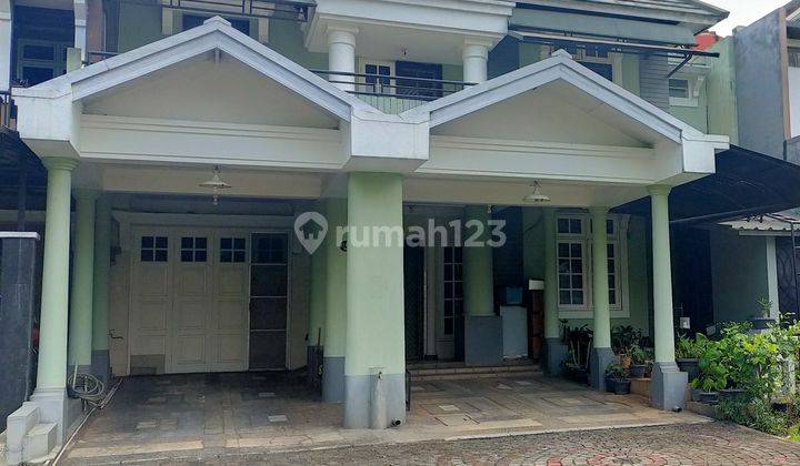 Rumah 2 lantai depan taman dan gerbang tol 1