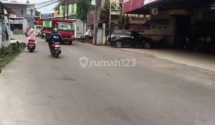 Di Jual Tanah Kosong ada bahan.Bangunan masih  operasional  area padat depan jalan raya 50 mter ke jalan Tol Cijago 1