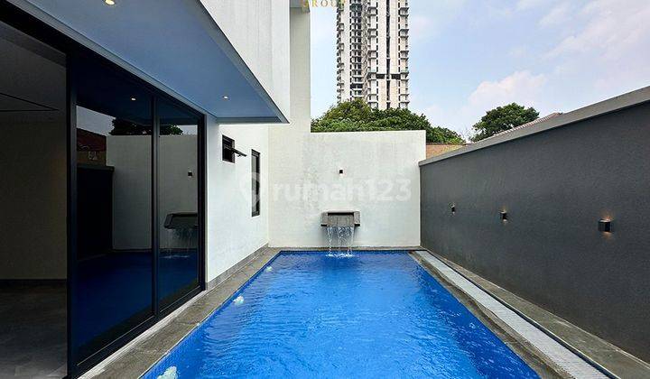 Rumah 3 Lantai Modern Minimalis Ada Pool Carport 1