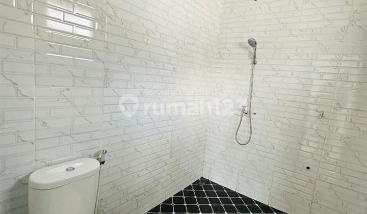 FOR SALE NEW TWO-STORY HOUSE  
24-hour security with one gate system  
Located in Cibinong, Bogor  
Near Cibinong Station 2