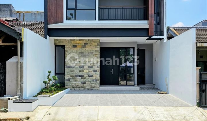 Modern Tropical House in a Cluster at Graha Raya Bintaro