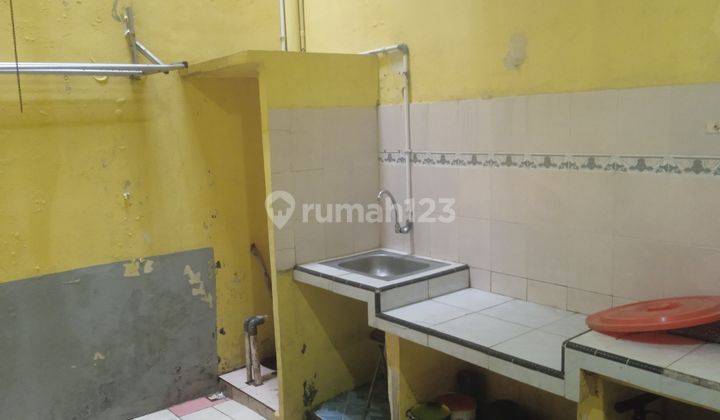 RUMAH DALAM KOMPLEKS  DI BUARAN 5