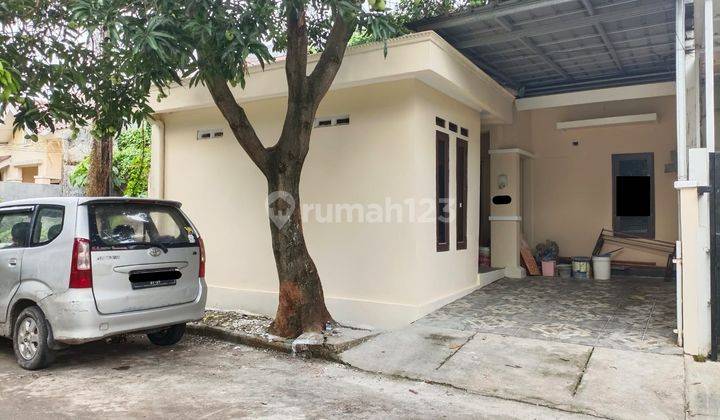 Rumah Murah Depan Taman Status SHM di Regency Melati Mas 1