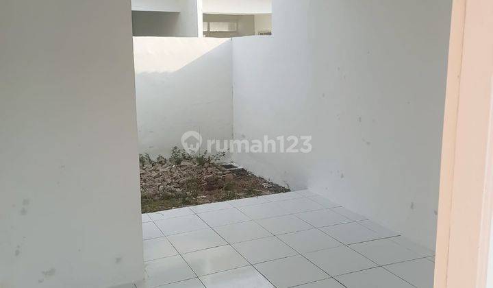 Comfortable 2BR House at Mustika Village Sukamulya By Travelio Realty 3