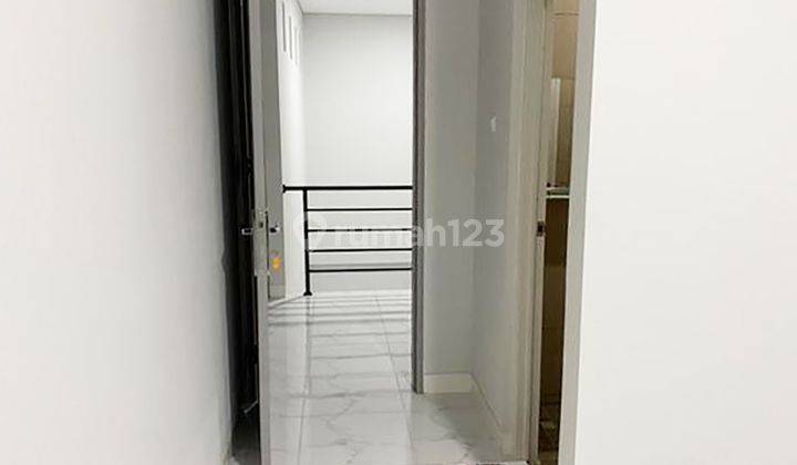 3br House At Jatimulya Small Living 2 By Travelio Realty 11