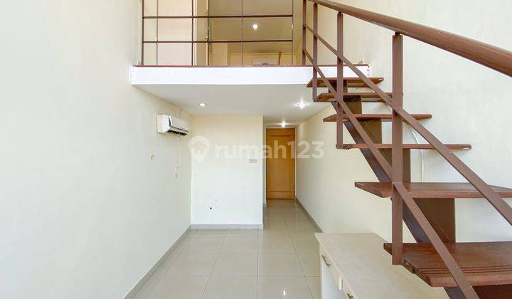 Studio Unfurnished Apartemen Dloft By Travelio