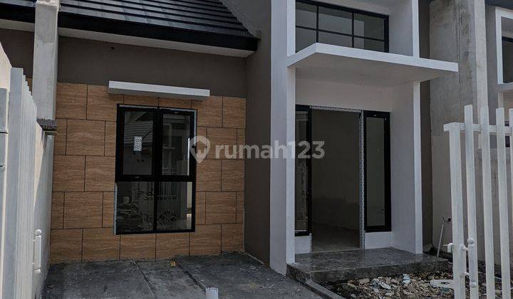 Rumah Baru free semua biaya KPR 100% dan Berlokasi 5 menit ke Merr dan Tol Tambak Sumur 1