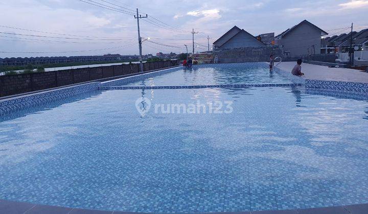 Rumah Baru free semua biaya KPR 100% dan Berlokasi 5 menit ke Merr dan Tol Tambak Sumur 5