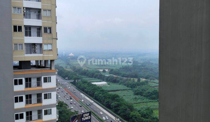 tampak depan apartemen murah selangkah ke stasiun