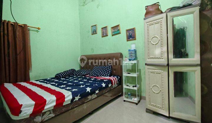 kamar tidur rumah 1,5 lantai di taman