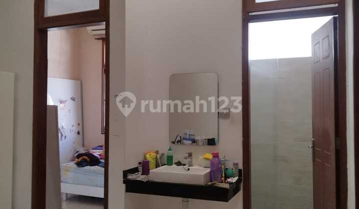 Two-story wide row house in Nginden Intan Timur 2