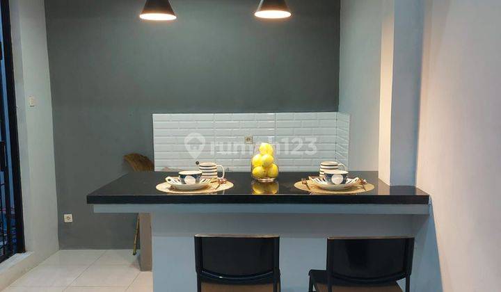 Rumah Furnished keren baru renovasi di lingkungan yang tenang semi cluster di Nusaloka Bsd 2