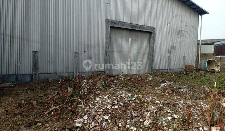 Tanah kosong bagus bonus rumah di jalan raya Kota Tangerang jual murah 1