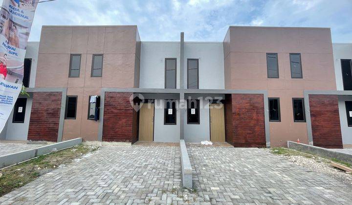Dijual over kredit rumah murah strategis di sepatan strategis pinggir jalan raya 1