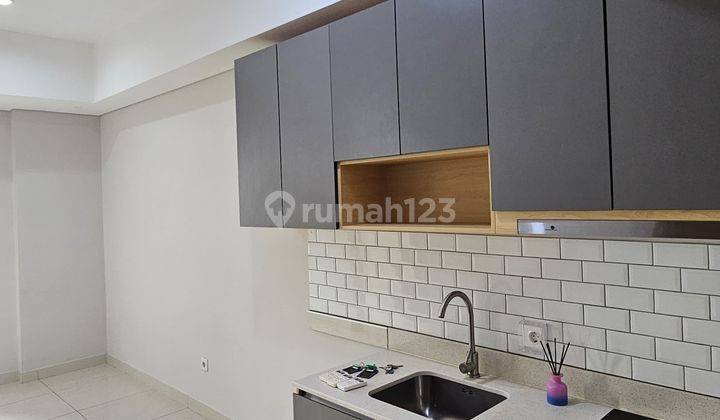 disewakan 2 bedroom semi furnish taman anggrek residence 1