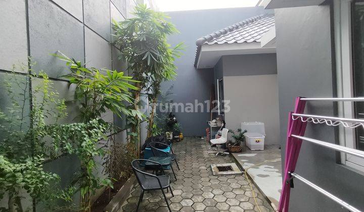 rumah estetik boulevard utama dengan pagar Aquarium  2