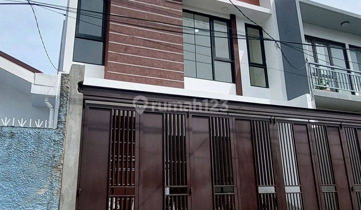 Rumah Sunrise Garden 2.5 Lantai Shm Jalan 2 Mobil 2