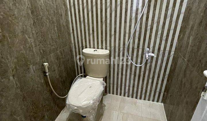 DI  RUMAH  DI PERUMAHAN DUTA GRAHA BLOK E10