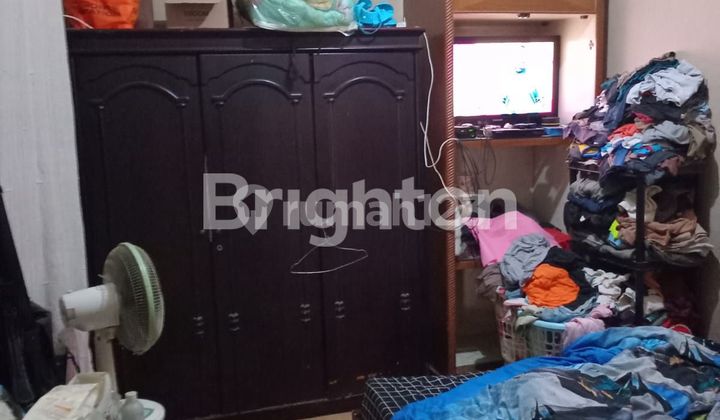 A 1.5-story house priced at 1 billion in Melati Mas Regency. 2