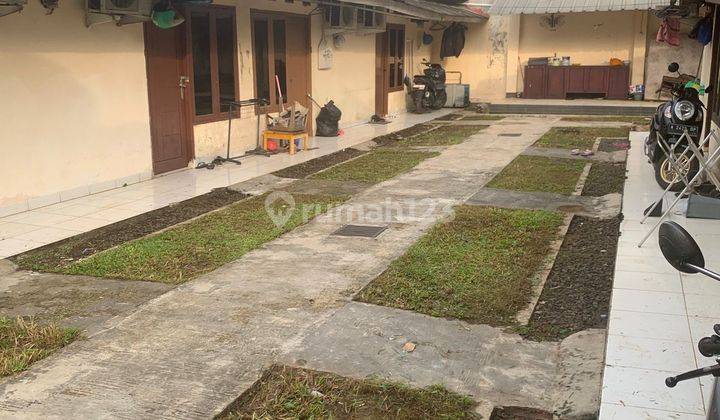 Dijual sangat murah rumah berbentuk kontrakan ada 11 pintu akses dua mobil full terisi semua buat investasi jangka panjang bagus ini tempat nya strategis muraaah 1