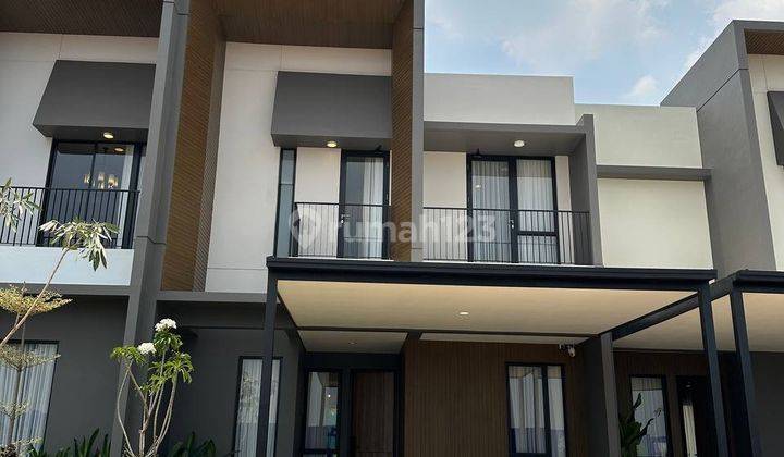 Rumah Lebar 7 Modern Tropis di Alam Sutera 1