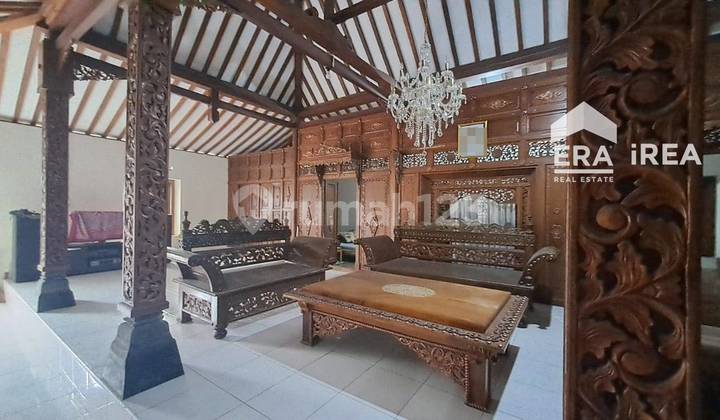 House Near Stadium with Carved Design.