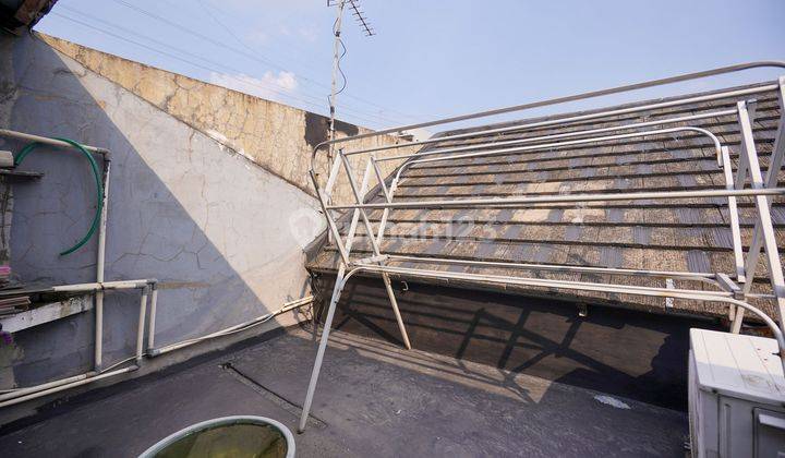 Rumah Hadap Utara dekat Gerbang Tol Pondok Gede Dibantu KPR J24194 2