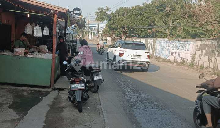 Land on the Side of Ciangsana Main Road with a House and 4 Small Shops.