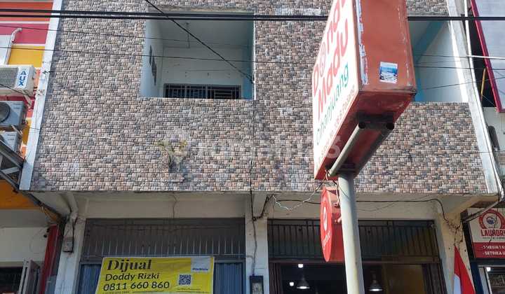 Two-door shop house plus warehouse on Sutomo Street (next to Marapalam gas station). 2