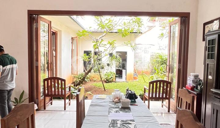 A house with a spacious, lush, and well-maintained yard in Delman Tanah Kusir. 2